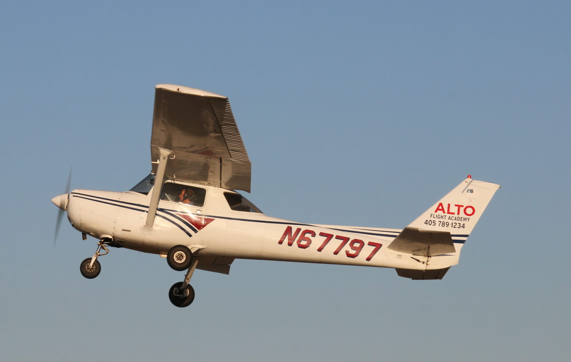 Training aircraft operating at Sundance Airport during challenging Oklahoma wind and weather conditions